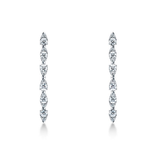 Introducing the Hearts On Fire Aerial 18K White Gold Dewdrop Stiletto Earrings, by Hearts on Fire, featuring a vertical arrangement of oval and tear-shaped gemstones in an elegant symmetrical pattern, showcased against a white background.