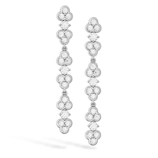 The Hearts On Fire Effervescence Drop Earrings, by Hearts on Fire, are exquisitely crafted from 18 Karat white gold and feature elegantly designed floral-shaped clusters. Each earring is set with four sparkling round diamonds, creating a shimmering, layered effect that is perfect for any occasion.