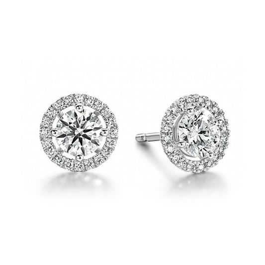 The Hearts On Fire Joy 18K White Gold Earrings from Hearts on Fire are a dazzling pair of earrings, showcasing round, brilliant-cut diamonds encircled by a halo of smaller diamonds.
