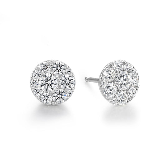 Introducing the Hearts On Fire Tessa 18K White Gold Earrings, a stunning pair of diamond earrings from Hearts on Fire. Each earring features a cluster of round, dazzling gemstones meticulously arranged in a circular pattern. These enchanting pieces are set in 18K white gold and beautifully displayed against a simple white background.