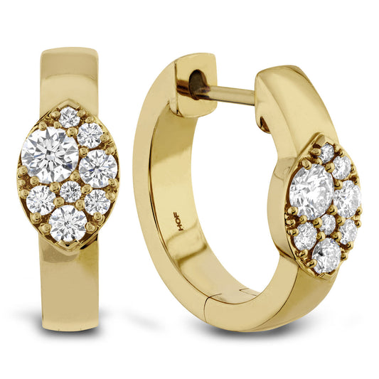 The Hearts On Fire Tessa 18K Yellow Gold Earrings radiate timeless allure, featuring clusters of sparkling round diamonds. The front view reveals an elongated cluster design, while the side view emphasizes the circular clasp mechanism, creating an elegant and luxurious piece from the renowned brand, Hearts on Fire.