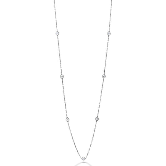 Introducing the Hearts On Fire 18K White Gold Pendant by Hearts on Fire, a graceful white gold creation adorned with evenly spaced small round diamonds along a fine chain. Part of an exquisite jewelry collection, its elegant design beautifully enhances the sparkle of each diamond.