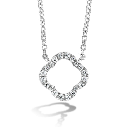 The Hearts On Fire Signature Petal 18K White Gold Pendant by Hearts on Fire is a silver necklace adorned with a pendant in the shape of a stylized four-leaf clover, encrusted with small, shimmering round diamonds. It glistens beautifully and casts a delicate shadow below.