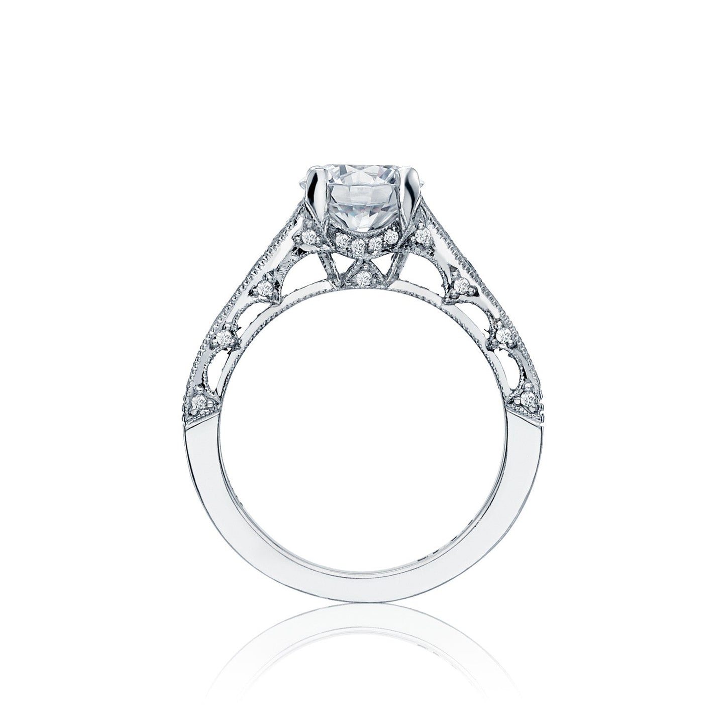 This stunning Tacori Reverse Crescent engagement ring features a prominent central diamond and an intricate filigree design on an 18K white gold band, enhanced by elegant channel set diamonds.