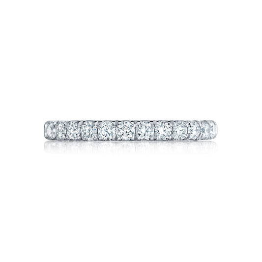 A Tacori Petite Crescent Platinum Round Brilliant Diamond Anniversary Ring, crafted by expert TACORI gemologists, is displayed on a white background. The closely set round-cut diamonds cover the entire visible surface of this exquisite ring.
