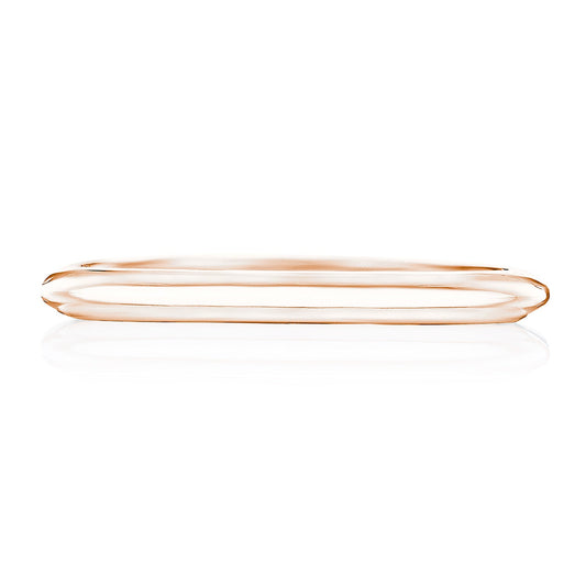 The Tacori Founder Collection Anniversary Ring, a wedding band crafted from 18K rose gold, features a slim and polished design with G color diamonds. Resting on a white background, it subtly echoes the signature Tacori crescent design.