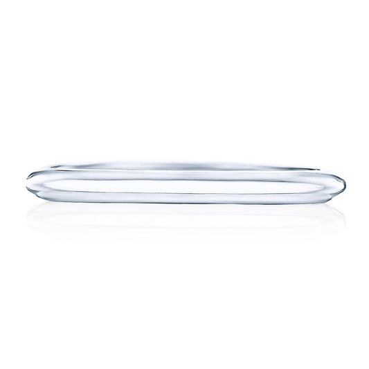 A sleek, minimalist 18K white gold wedding band from the Tacori Founder Collection lies flat on a white background, reminiscent of the graceful Tacori crescent. Its thin, smooth design reflects light brilliantly, showcasing its polished surface with a diamond-intense sparkle.