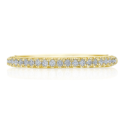 The Tacori Founder Collection 18K Yellow Gold Round Brilliant Pavé Diamond Anniversary Ring features a delicate band of yellow gold embellished with a continuous row of round, sparkling diamonds in the French-pavé setting along its outer edge. Its elegant simplicity allows the light to enhance the brilliance of the diamonds, while the plain white background accentuates every intricate detail characteristic of Tacori’s signature crescent design.