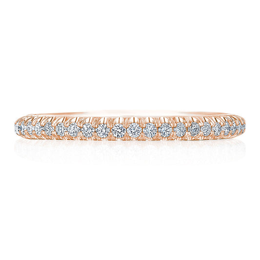 A delicate 18K rose gold band encrusted with a row of small, sparkling round brilliant pavé set diamonds. The design is sleek and elegant, showcasing the Tacori crescent signature with a continuous sequence of gems set closely together around the band. This piece is from the Tacori Founder Collection and is named the Tacori Founder Collection 18K Rose Gold Round Brilliant Pavé Diamond Eternity Ring.