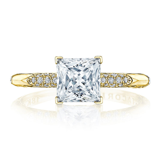 The Tacori Founders Collection 18K Yellow Gold Princess Solitaire Semi Mount with Diamond Band Accent Engagement Ring showcases a dazzling, square-cut diamond at its center. The band, embellished with smaller round diamonds on each side, emanates elegance and brilliance similar to the iconic Tacori crescent design.