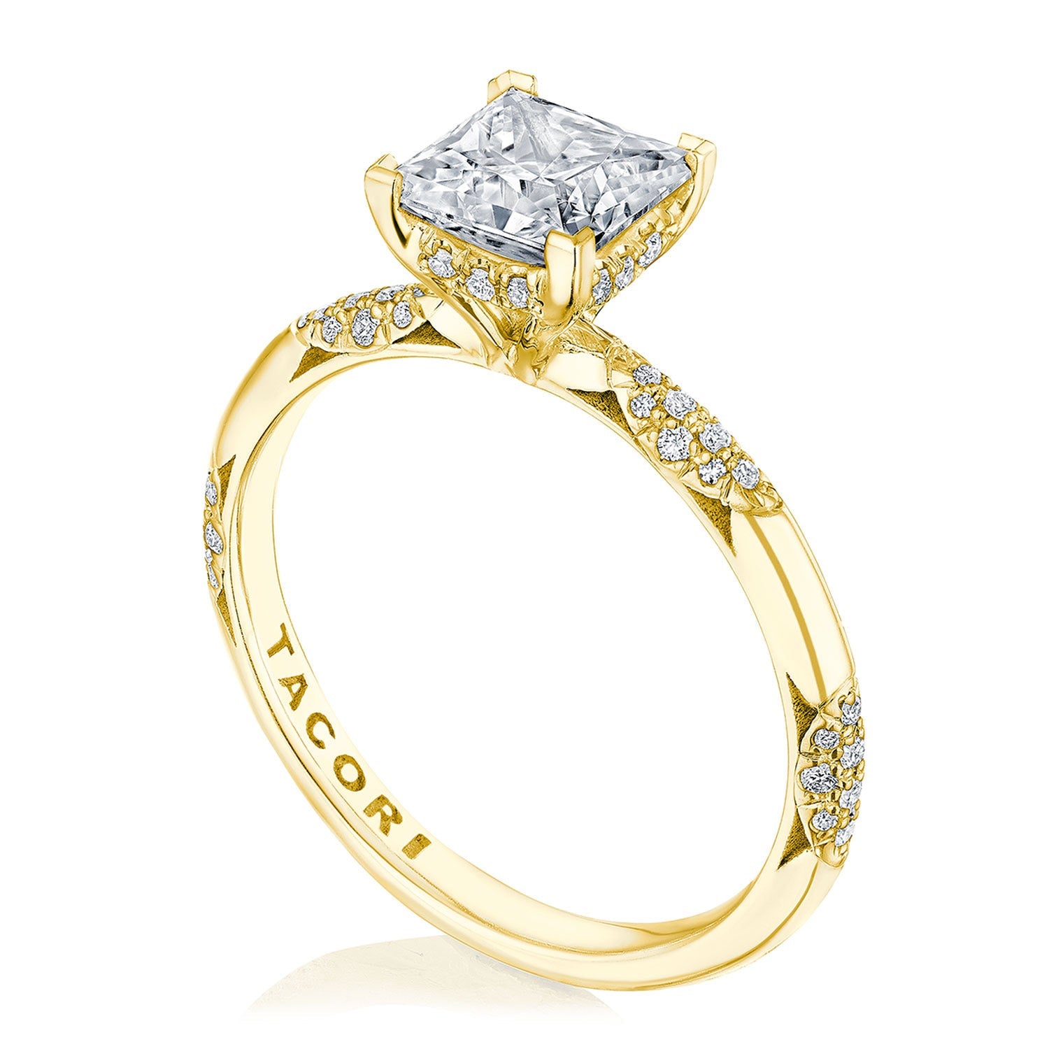 This exquisite Tacori Founders Collection engagement ring in 18K yellow gold highlights a stunning princess solitaire diamond set prominently, featuring smaller diamonds along the band. It includes the signature Tacori crescent design and is engraved with "TACORI" on the inside.