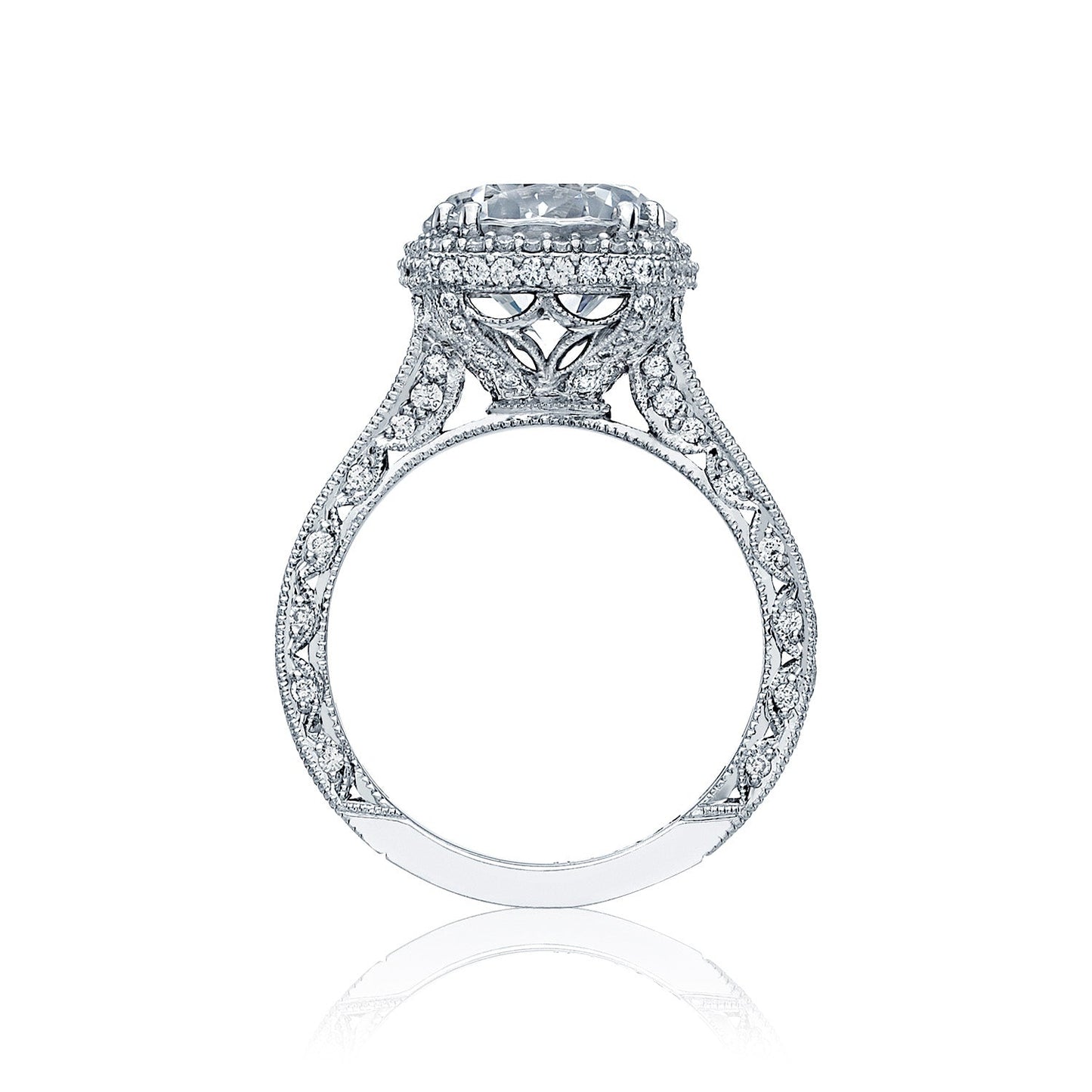 This stunning Tacori Classic Crescent RoyalT Platinum engagement ring showcases an intricate design featuring a prominent round brilliant diamond, elegantly elevated above a delicately detailed, lace-like band and accented with glimmering small diamonds.