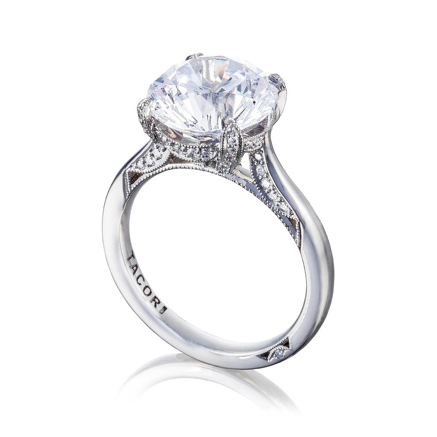 Explore the Tacori Simply Tacori RoyalT Platinum Round Brilliant Solitaire Semi Mount with Diamond Band Accent Engagement Ring. Featuring a large round diamond in a classic prong setting, this piece is elegantly detailed and showcases small accent diamonds that reflect the craftsmanship of Tacori.
