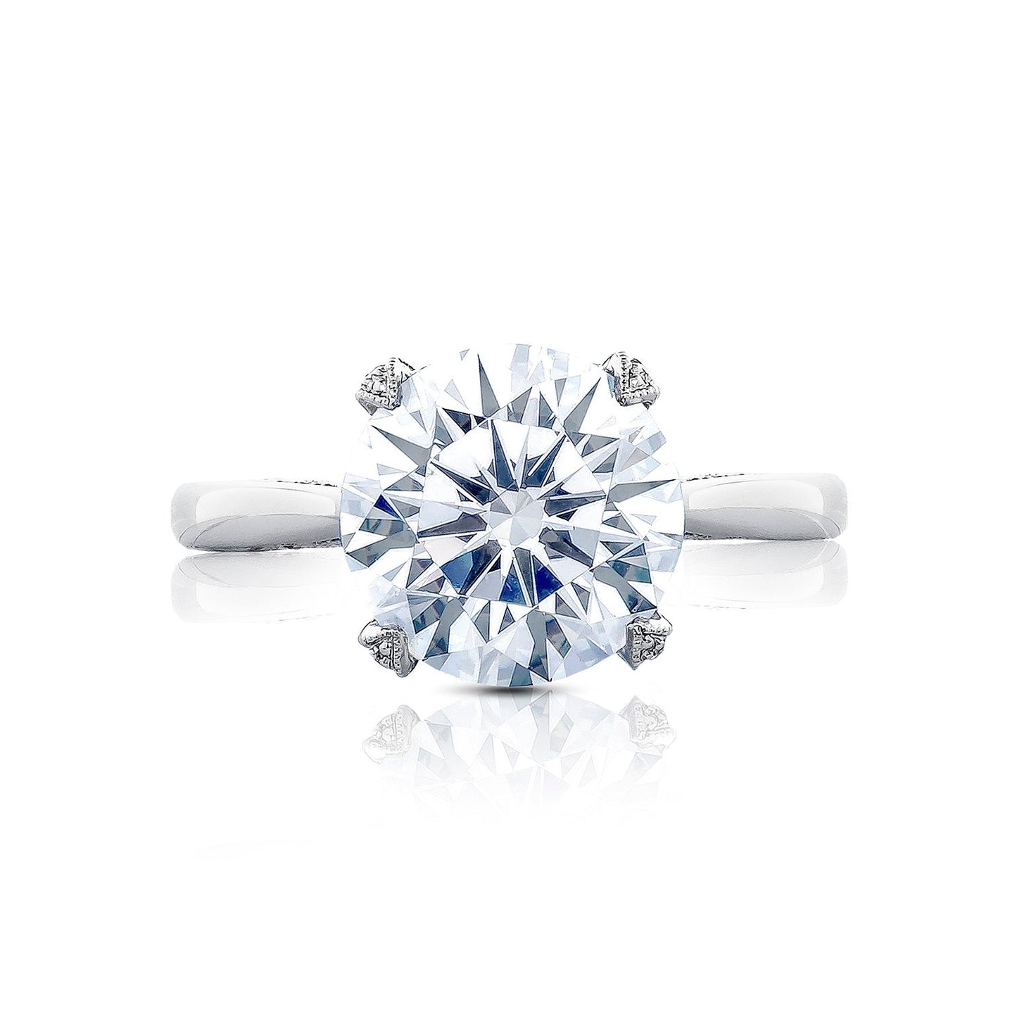 This close-up image features the Tacori Simply Tacori RoyalT Platinum Round Brilliant Solitaire Semi Mount Engagement Ring. It highlights the elegant round diamond set in a simple, polished band, crafted by Tacori gemologists to reflect light vividly like a grand cathedral.