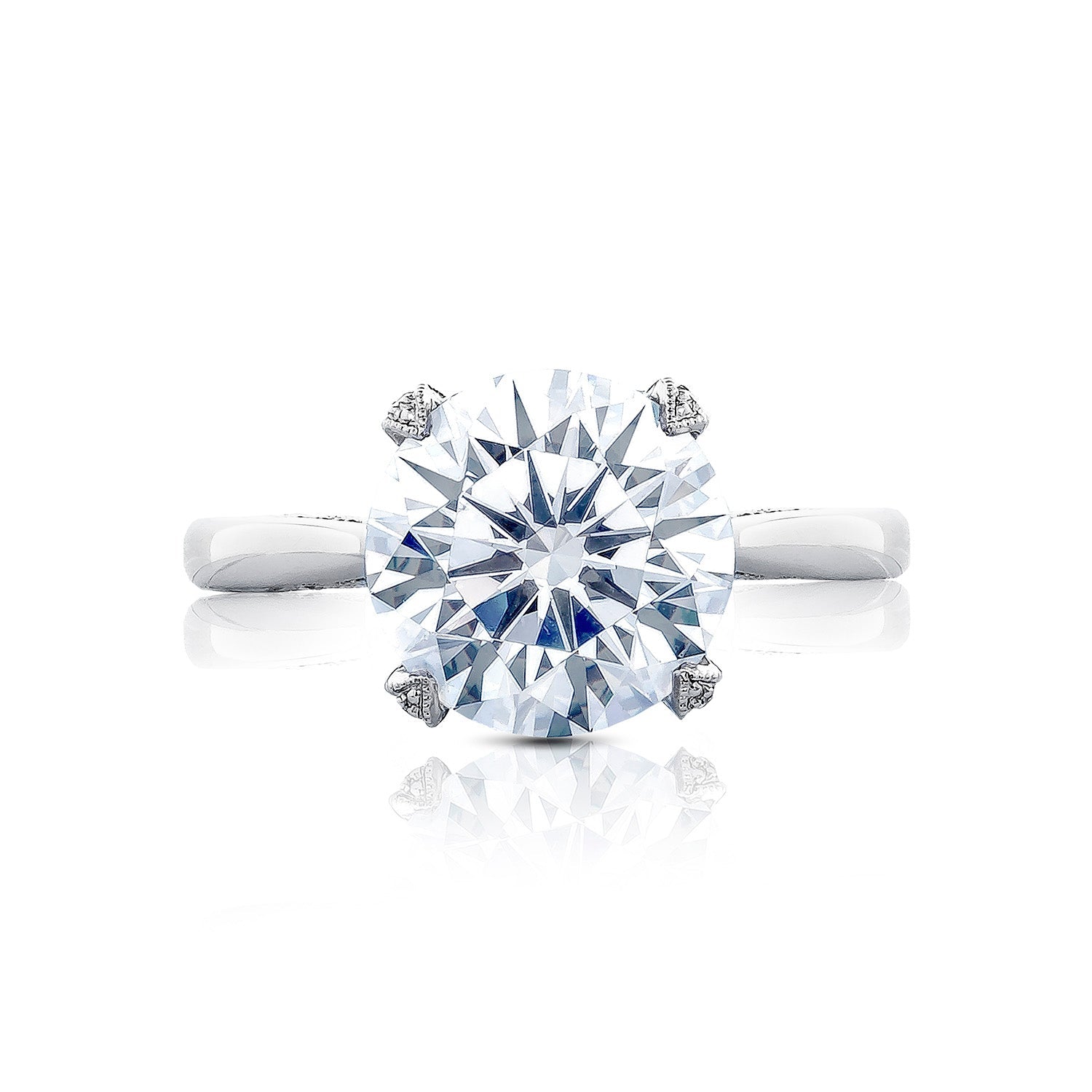 This close-up image features the Tacori Simply Tacori RoyalT Platinum Round Brilliant Solitaire Semi Mount Engagement Ring. It highlights the elegant round diamond set in a simple, polished band, crafted by Tacori gemologists to reflect light vividly like a grand cathedral.