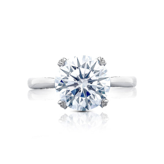 This close-up image features the Tacori Simply Tacori RoyalT Platinum Round Brilliant Solitaire Semi Mount Engagement Ring. It highlights the elegant round diamond set in a simple, polished band, crafted by Tacori gemologists to reflect light vividly like a grand cathedral.