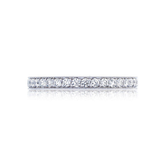 The Tacori Classic Crescent RoyalT platinum anniversary ring, featuring a dazzling array of small round brilliant pavé diamonds, is polished to perfection and set against a white background.
