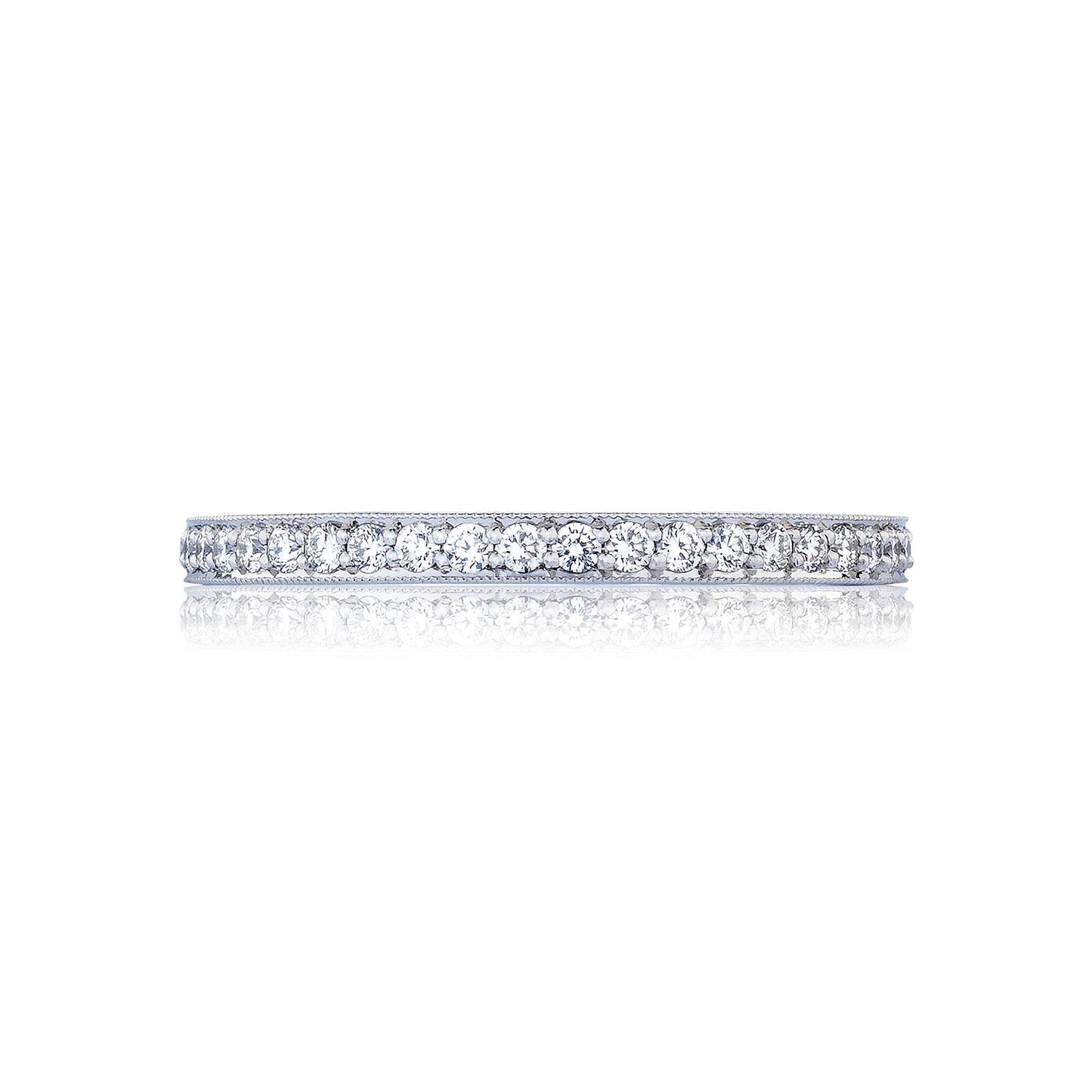 The Tacori RoyalT Sculpted Crescent Platinum Round Brilliant Pavé Diamond Anniversary Ring features a slim, platinum band encrusted with G color diamonds that sparkle brilliantly against the plain white background.