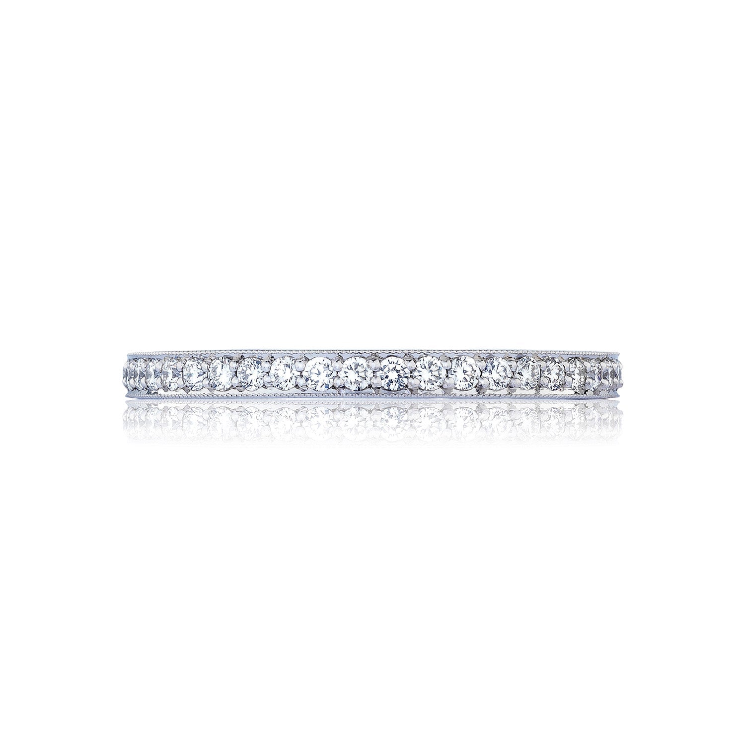 The Tacori RoyalT Sculpted Crescent Platinum Round Brilliant Pavé Diamond Anniversary Ring features a slim, platinum band encrusted with G color diamonds that sparkle brilliantly against the plain white background.