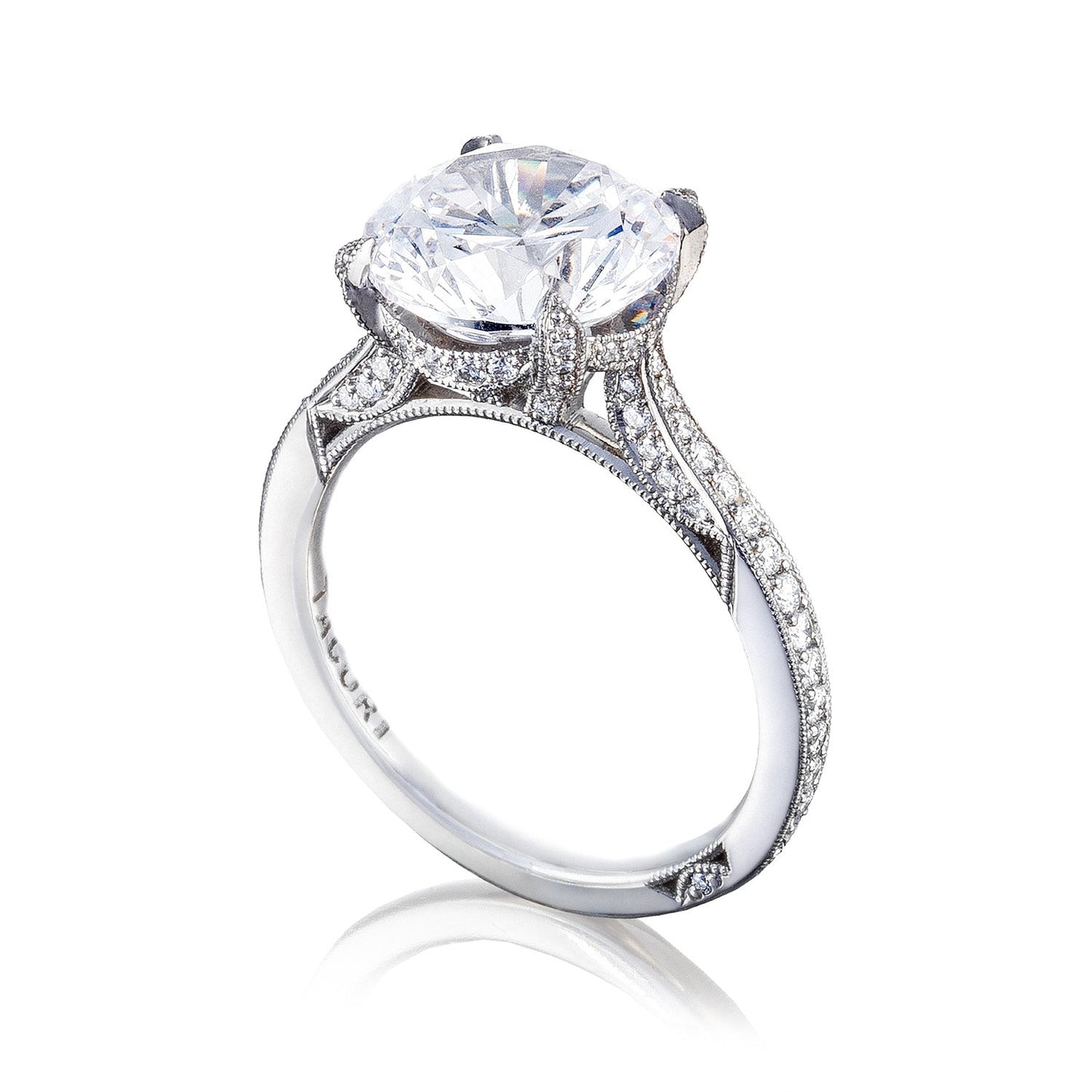 Introducing the Tacori Simply Tacori RoyalT Platinum Round Brilliant Solitaire Semi Mount with Diamond Band Engagement Ring, a breathtaking platinum engagement ring from Tacori. This masterpiece showcases a solitaire design, highlighted by a large round diamond centerpiece and smaller diamonds encrusted along the band, all elegantly displayed against a pristine white background.