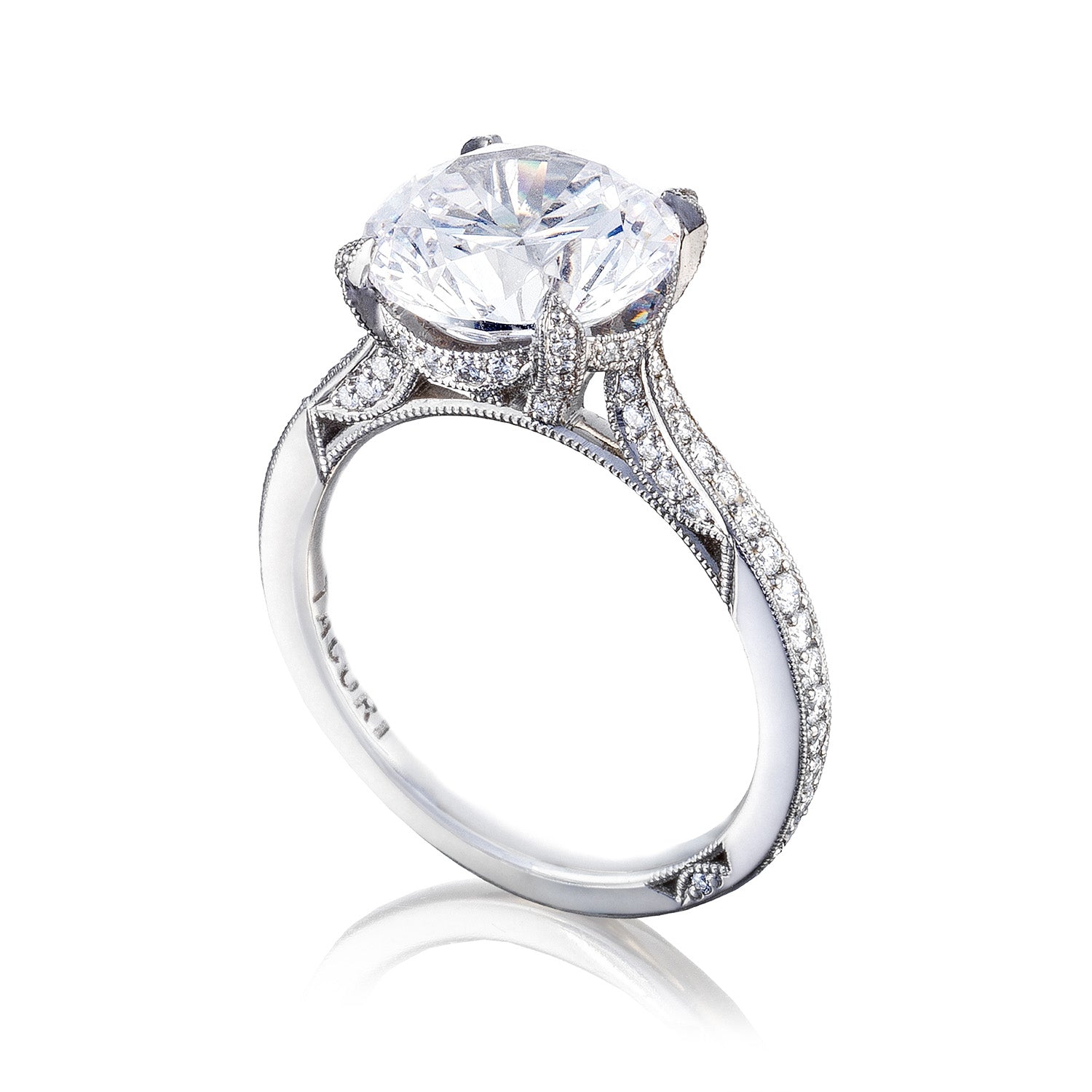 Introducing the Tacori Simply Tacori RoyalT Platinum Round Brilliant Solitaire Semi Mount with Diamond Band Engagement Ring, a breathtaking platinum engagement ring from Tacori. This masterpiece showcases a solitaire design, highlighted by a large round diamond centerpiece and smaller diamonds encrusted along the band, all elegantly displayed against a pristine white background.