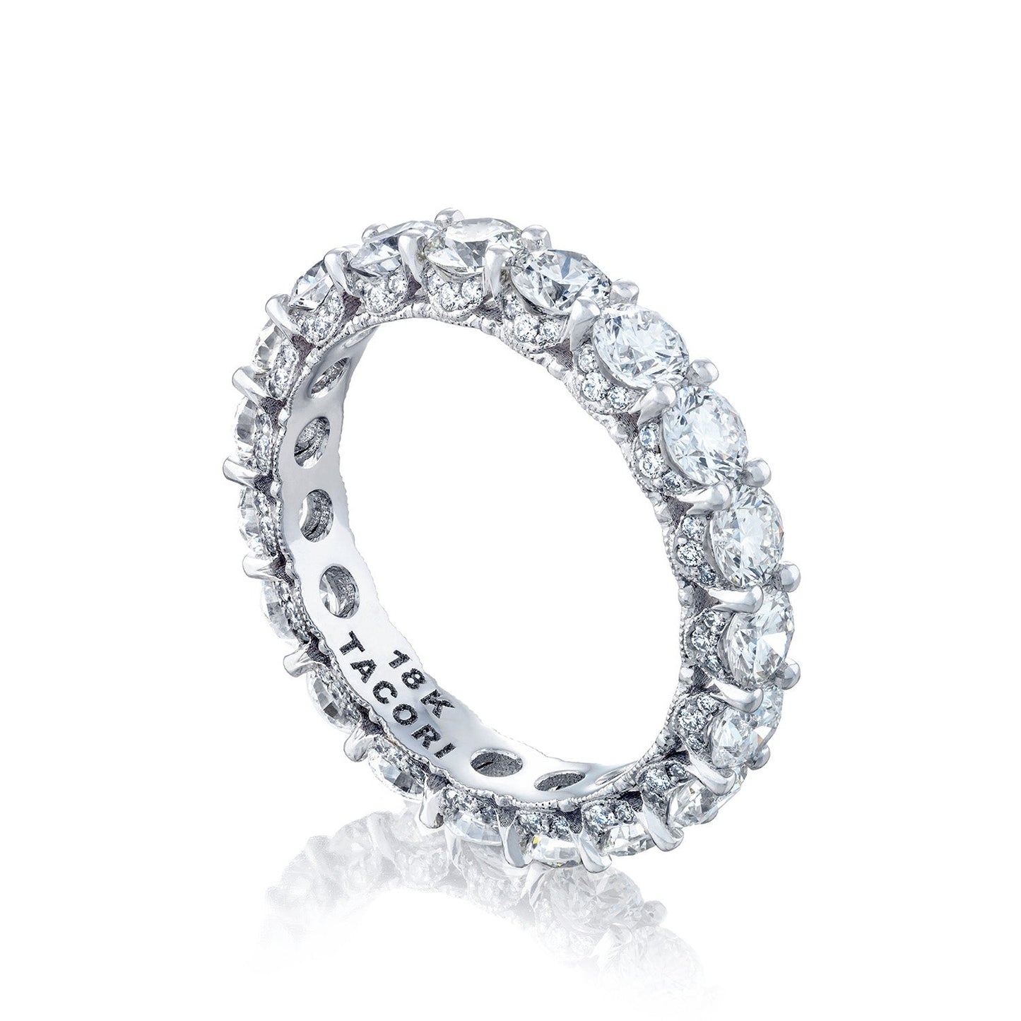 A sparkling Tacori Classic Crescent RoyalT platinum eternity band, featuring a continuous row of G color round brilliant diamonds, engraved with "18K TACORI" on the inner side.