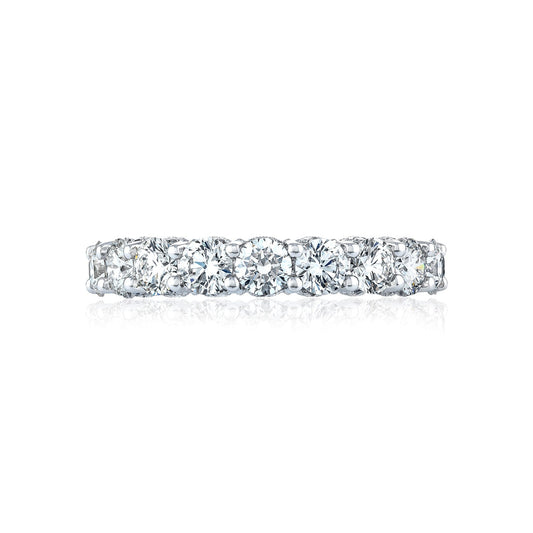 A Tacori Classic Crescent RoyalT platinum anniversary ring adorned with a row of sparkling G color round brilliant diamonds, reflecting light on a white background. The design features a continuous pattern of closely set gemstones.