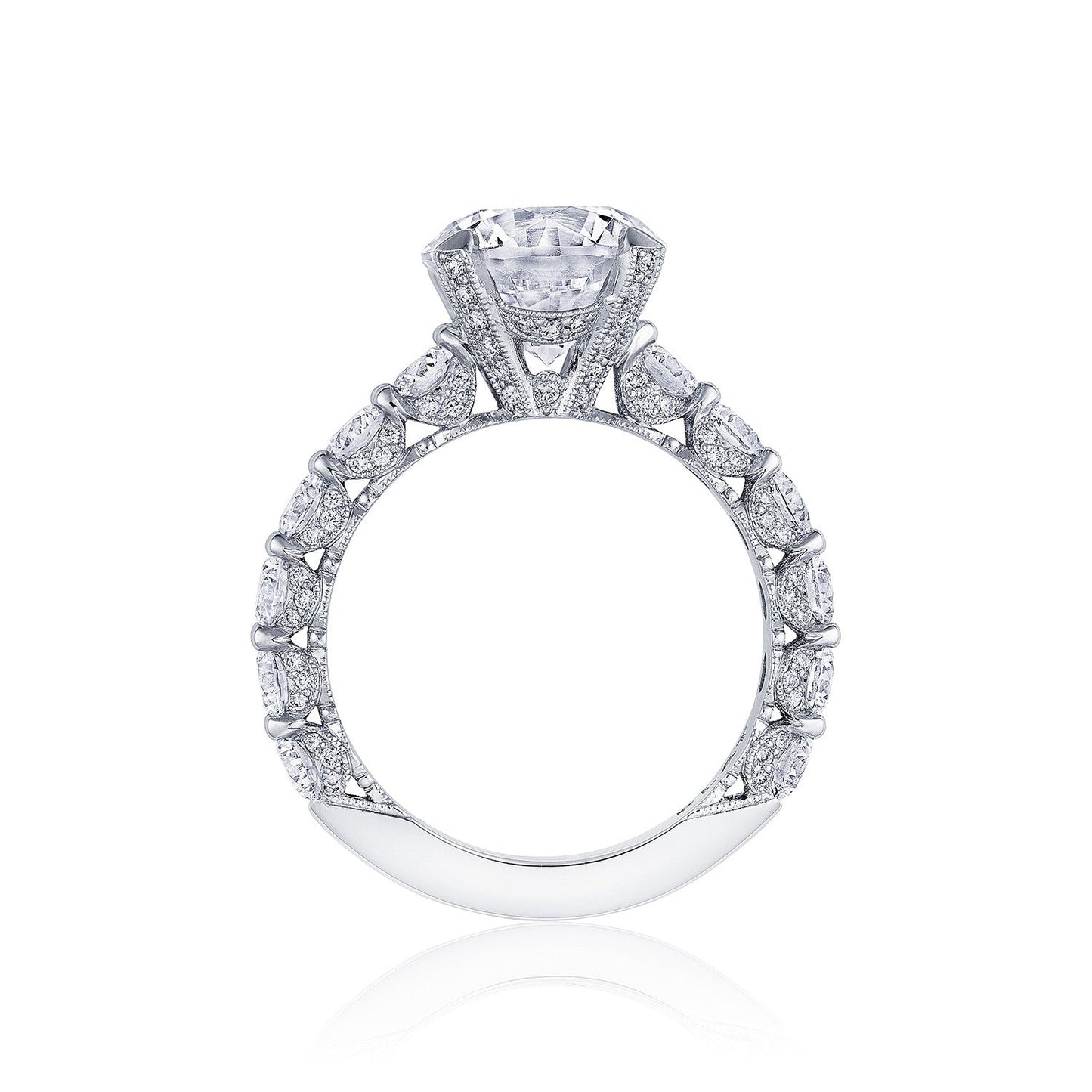 This engagement ring, crafted by Tacori, is a luxurious piece from the Classic Crescent RoyalT collection. It features a prominent round brilliant solitaire as its centerpiece, set in platinum. The band is elegantly adorned with smaller diamonds, enhancing its sparkling brilliance and refined elegance.