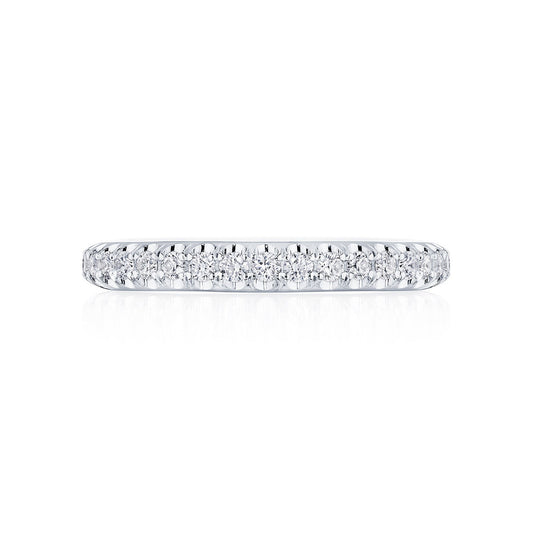 This exquisite platinum eternity ring from Tacori's Founder's Collection showcases a row of pavé-set round brilliant diamonds that shimmer beautifully along its band. The Tacori signature design enhances the elegance of this timeless piece.