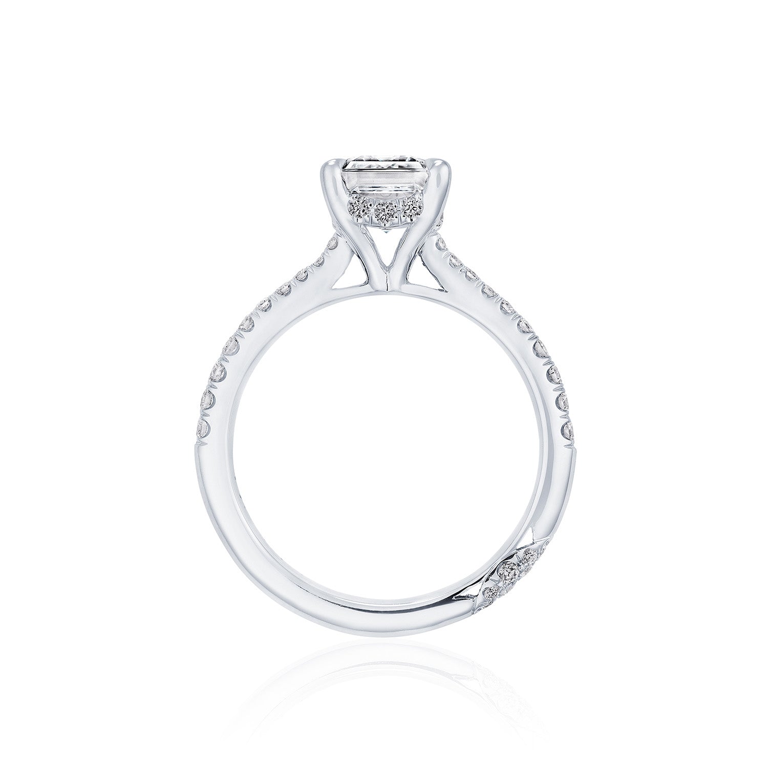 The Tacori Founder's Collection RoyalT Platinum Emerald Solitaire Semi Mount with Diamond Band Engagement Ring by Tacori showcases a sophisticated setting with a prominent emerald center stone, complemented by smaller diamonds along the band to enhance its intricate design.