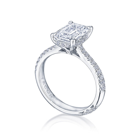 The Tacori Founder's Collection RoyalT Platinum Emerald Solitaire Semi Mount with Diamond Band Engagement Ring showcases a large, rectangular diamond in a claw setting. The platinum band is adorned with smaller diamonds, enhancing the ring's elegant and sparkling design.