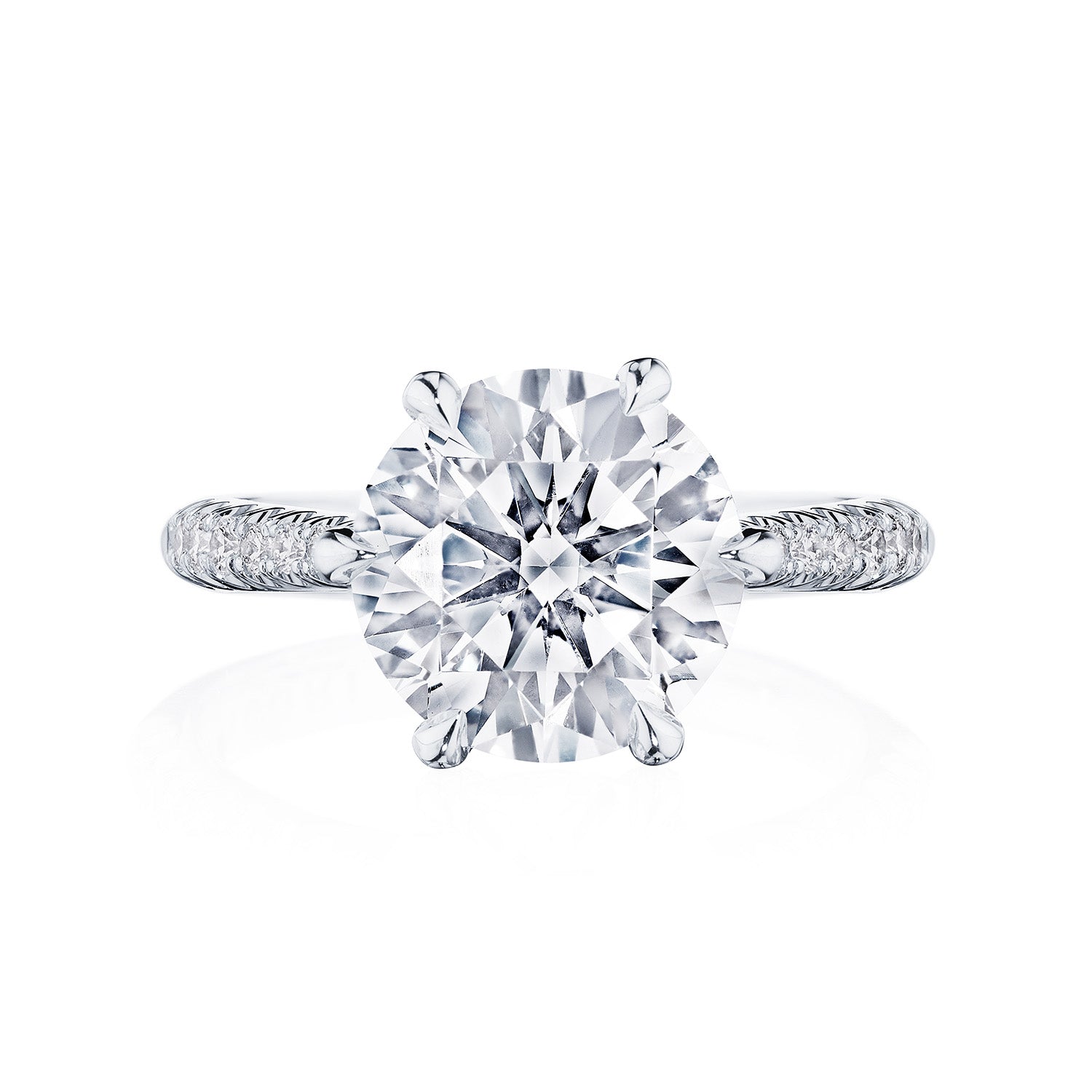 The Tacori Founder's Collection RoyalT Platinum Round Brilliant Solitaire Semi Mount with Diamond Band Engagement Ring features a large, round-cut diamond as its centerpiece on a polished band, exemplifying the exquisite craftsmanship of Tacori gemologists.