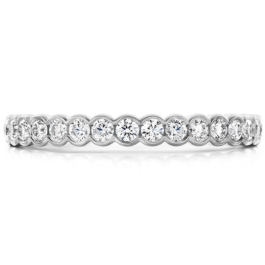 18K white gold band showcasing round brilliant diamonds in a bezel setting, the Hearts On Fire Isabelle anniversary ring embodies elegance and timeless style.