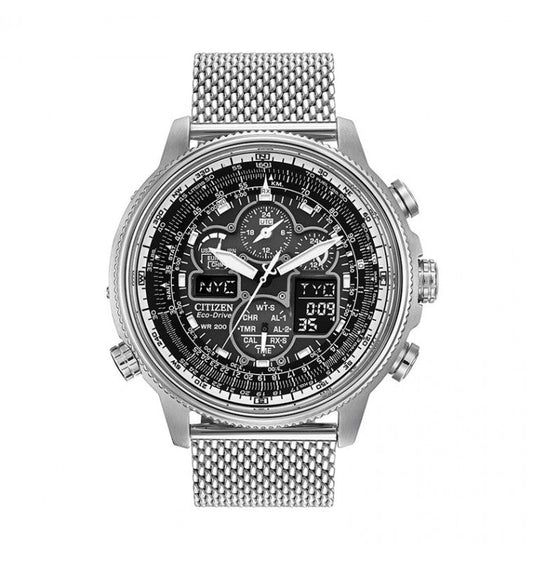 A sophisticated CITIZEN Promaster Navihawk A-T Eco-Drive 48mm watch in black and silver, featuring a metallic mesh strap. The watch face includes multiple dials and digital screens, intricately designed for tracking various time zones, with Atomic Clock synchronization and a perpetual calendar chronograph function.