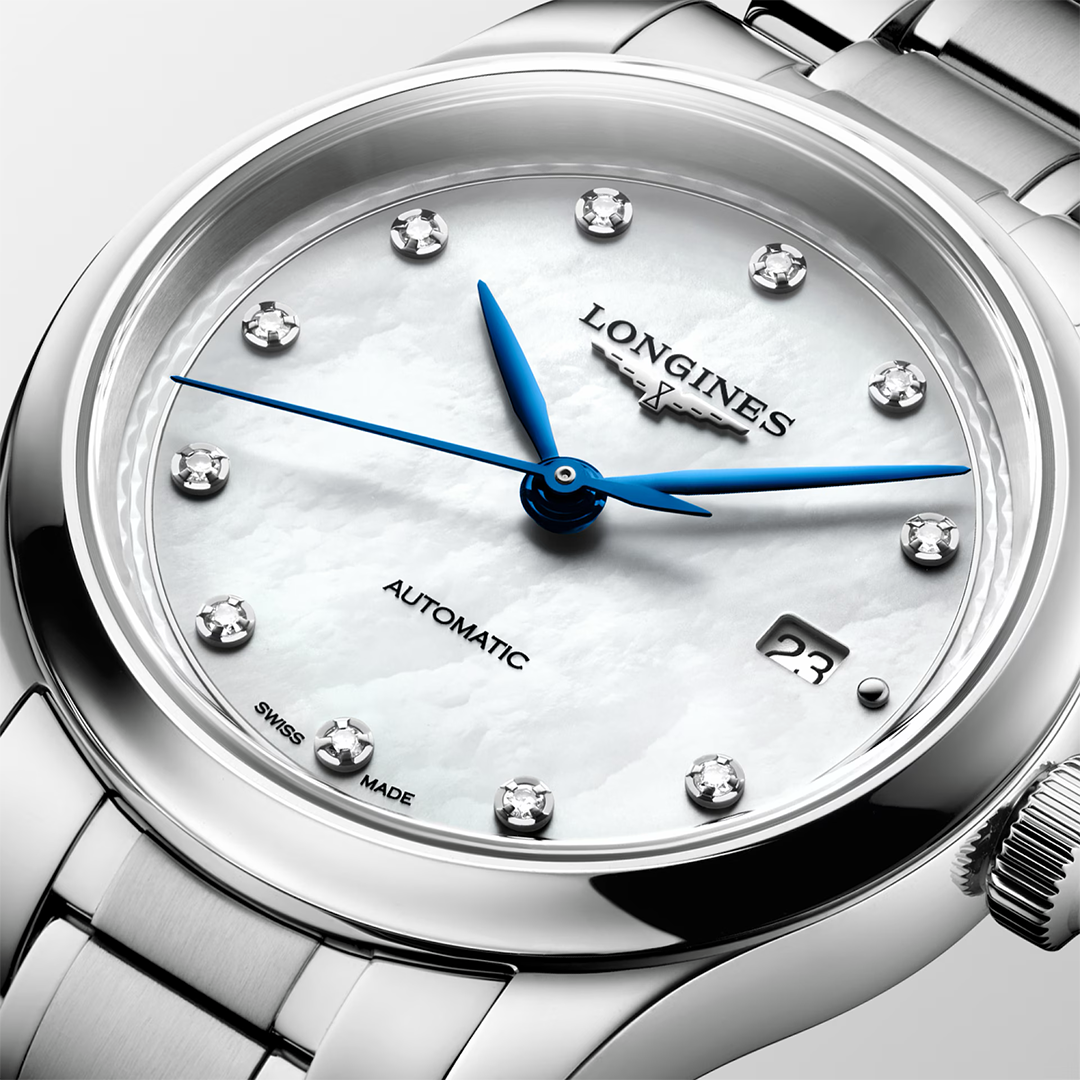 Longines Master Collection Automatic 30mm Watch with a silver-tone finish, white mother-of-pearl dial, diamond hour markers, blue hands, and a date window.