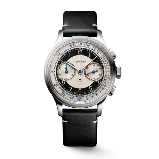 Discover the Longines Heritage Classic Automatic 40mm Watch, boasting a vintage-inspired design. This exquisite wristwatch includes a black leather strap and a silver case. The dial showcases a tachymeter scale, three subdials, blue accent hands, and prominently features the “Longines” branding at its center.