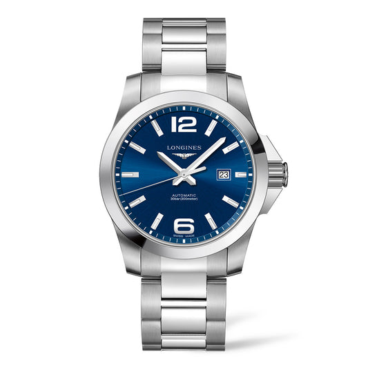 The Longines Conquest Classic Automatic 43mm Watch is a sophisticated piece from Longines featuring a silver case and stainless steel strap. It boasts a round blue face with silver hour markers, luminescent hands, and a date window at the 3 o'clock position, all powered by an automatic movement.