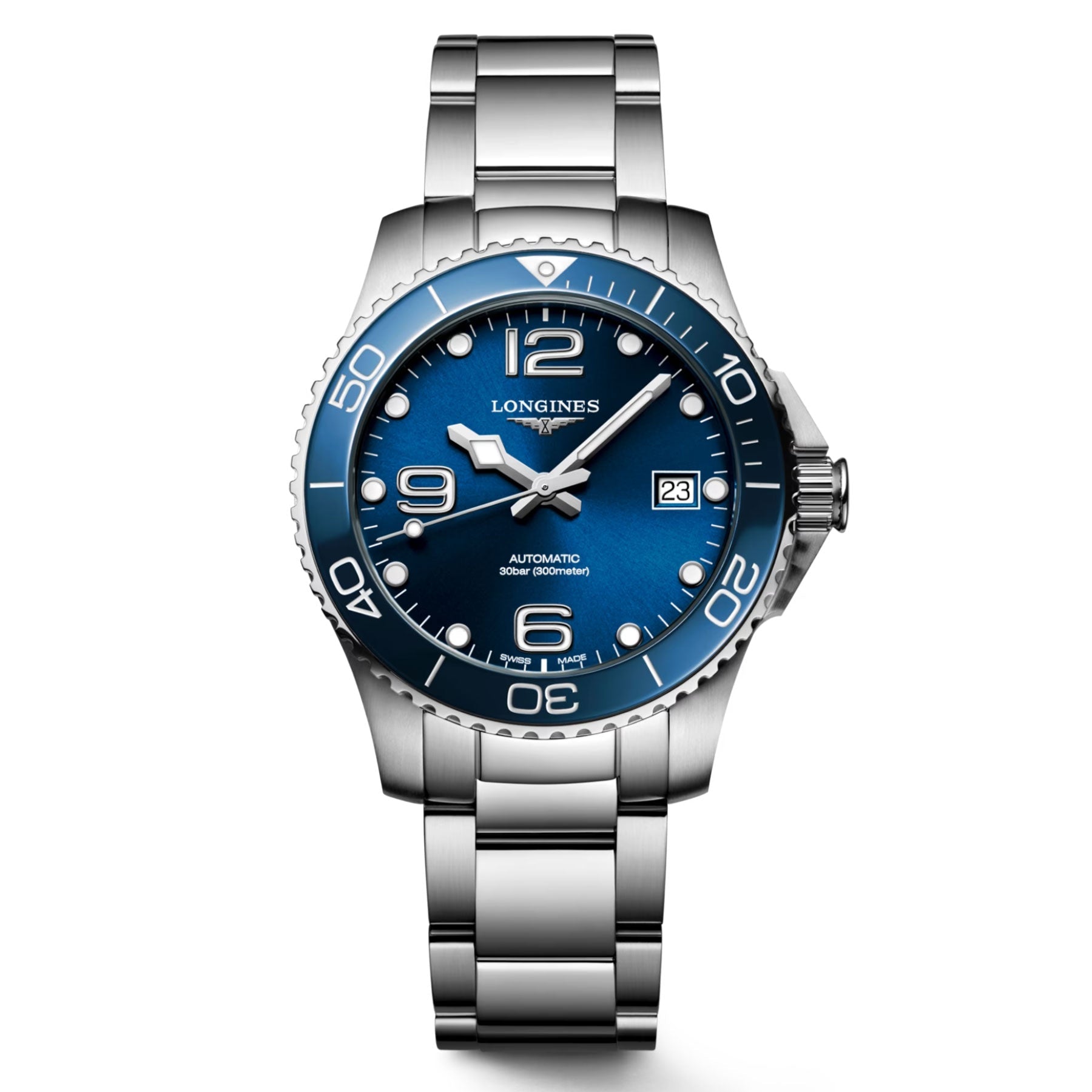 The Longines Hydroconquest Automatic 39mm Watch, from the reputable brand Longines, showcases a stainless steel design with a blue dial featuring silver accents. It includes prominent numerals at 12, 6, and 9 o'clock positions, a date window located at 3 o'clock, and a round bezel with minute markings on its metal link bracelet.