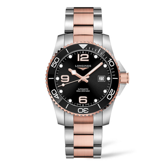 The Longines HydroConquest Automatic 41mm Watch by Longines features a silver and rose gold metal band. It has a black watch face with white numerals and markings, alongside a date display. The bezel is designed in black with silver numerals and markings.