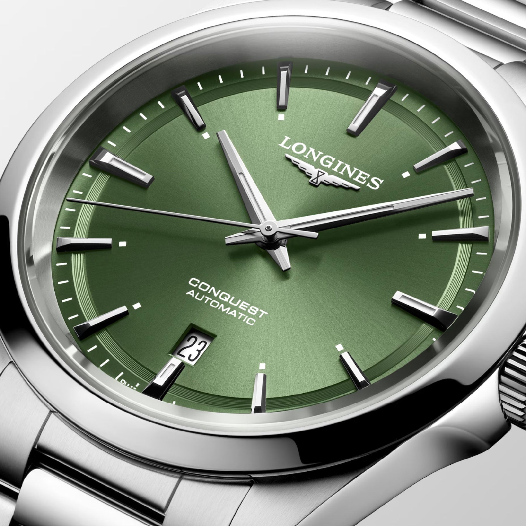 Close-up image of the Longines Conquest Automatic 41mm Watch, showcasing elegance with its green dial and silver hour markers. A functional date window at 3 o'clock complements its design, while the polished silver metal strap highlights its impeccable performance.