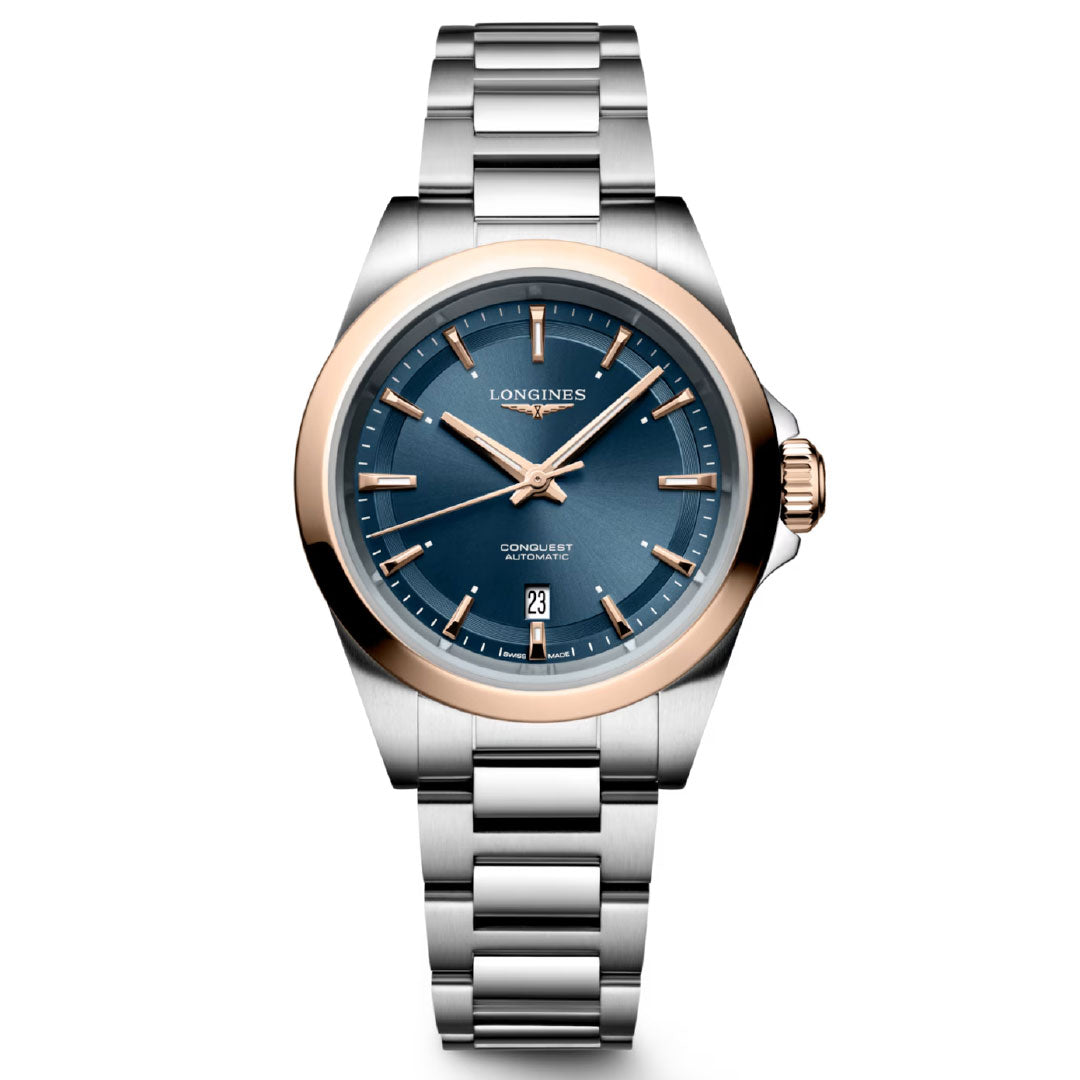 The Longines Conquest Automatic 30mm Watch features a blue dial, gold bezel, two-tone case and bracelet, date at 6 o’clock, and gold hands and hour markers—blending sporty style with elegance for everyday wear.