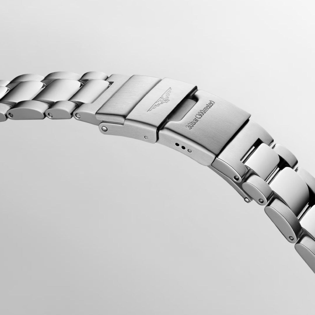 A chic bracelet crafted in stainless steel from Longines, a renowned Swiss watch brand, featuring a polished metal clasp adorned with engraved logos and text. The smooth and reflective links of this exquisite HydroConquest Automatic 41mm Watch design are elegantly set against a light grey background.