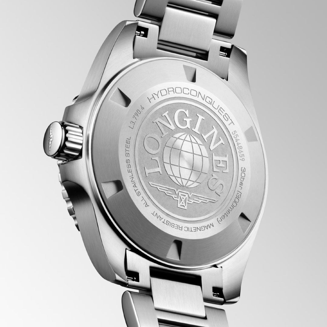 The image displays the back of a Longines HydroConquest Automatic 41mm Watch, a distinguished piece from the HYDROCONQUEST collection by Longines. It features a stainless steel case and bracelet, complete with engraved details such as the brand name, logo, and technical specifications. The watch is elegantly finished with a brushed metal look.