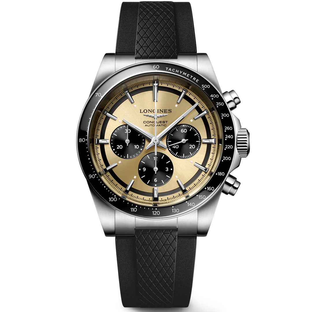 The Longines Conquest Chronograph Automatic 42mm Watch features a gold and black dial with three subdials, a tachymeter bezel, and a black textured rubber strap.
