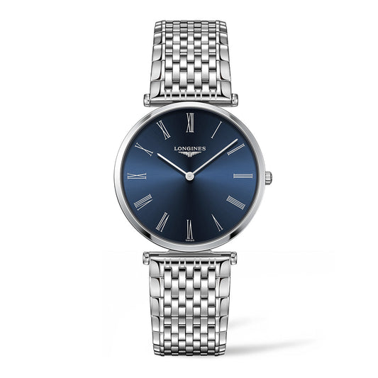 A Longines La Grande Classique Quartz 36mm watch, featuring a silver design with a blue face and Roman numeral hour markers. The watch comes with a linked metal bracelet, proudly displaying the Longines brand name on the dial. Its thin and elegant hands enhance its classic and sophisticated overall design.