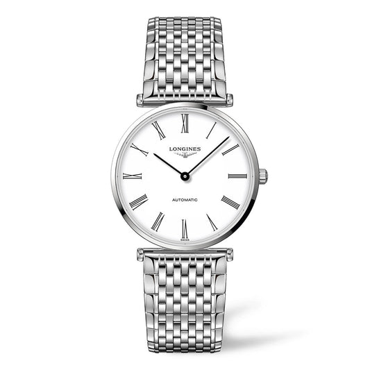 The Longines La Grande Classique Automatic 36mm Watch is a silver wristwatch featuring a round white face adorned with black Roman numerals and two slim hands. The Longines brand name is prominently displayed on the face, and it includes a linked metal bracelet strap.