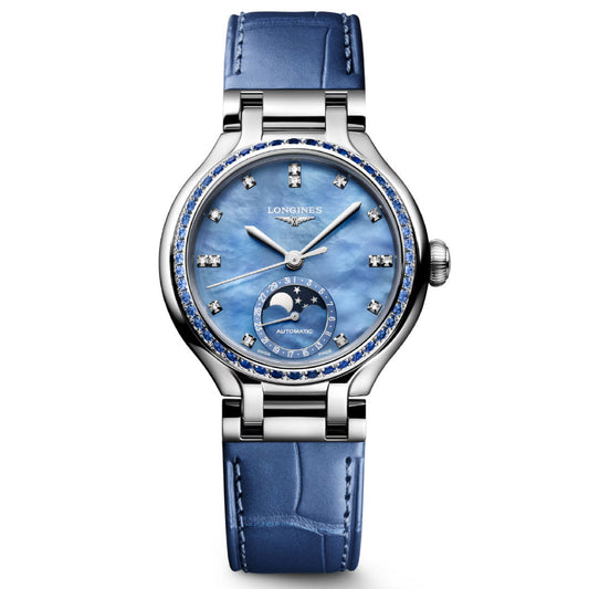 The Longines Primaluna Moonphase Automatic 34mm Watch features a blue leather strap, silver case, blue mother-of-pearl dial with diamond markers, moon phase at 6 o’clock, and gemstone-set bezel—offering elegant luxury for women.