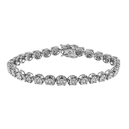 The Simon G. 18K White Gold Tennis Bracelet showcases a continuous row of round, sparkling white diamonds totaling 2.19 ctw, elegantly set in intricate links, with an elegant clasp. The bracelet is beautifully displayed against a white background.