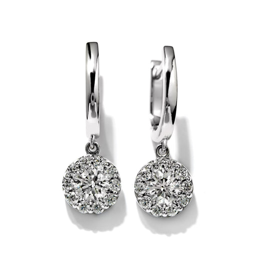 The Hearts On Fire Fulfillment 18K White Gold Drop Earrings, crafted with round diamond-encrusted pendants and displayed from the front against a plain white background, embody the elegance synonymous with Hearts on Fire designs.