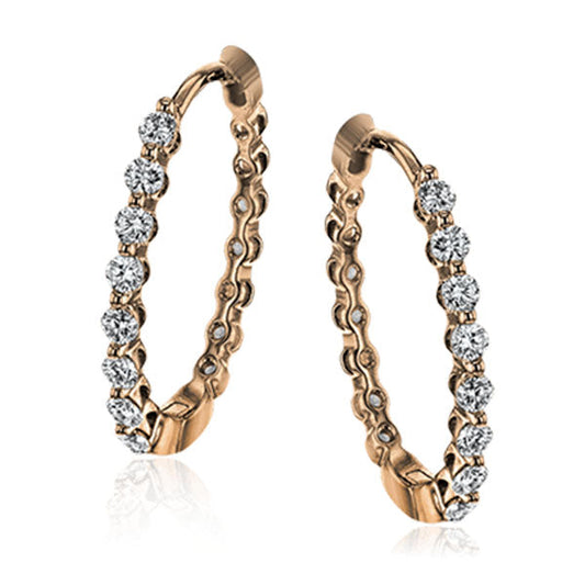 The Simon G. 18K Rose Gold Diamond Hoop Earrings blend elegance with sophistication. Expertly crafted in 18K rose gold, they feature a circular design encrusted with sparkling diamonds, with evenly placed gems along the outer edge to create a truly luxurious appearance.